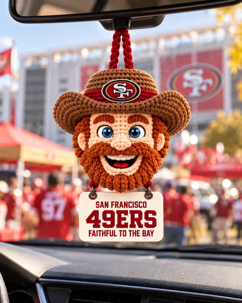 Niners crochet car hanging on a car rearview mirror at the stadium
